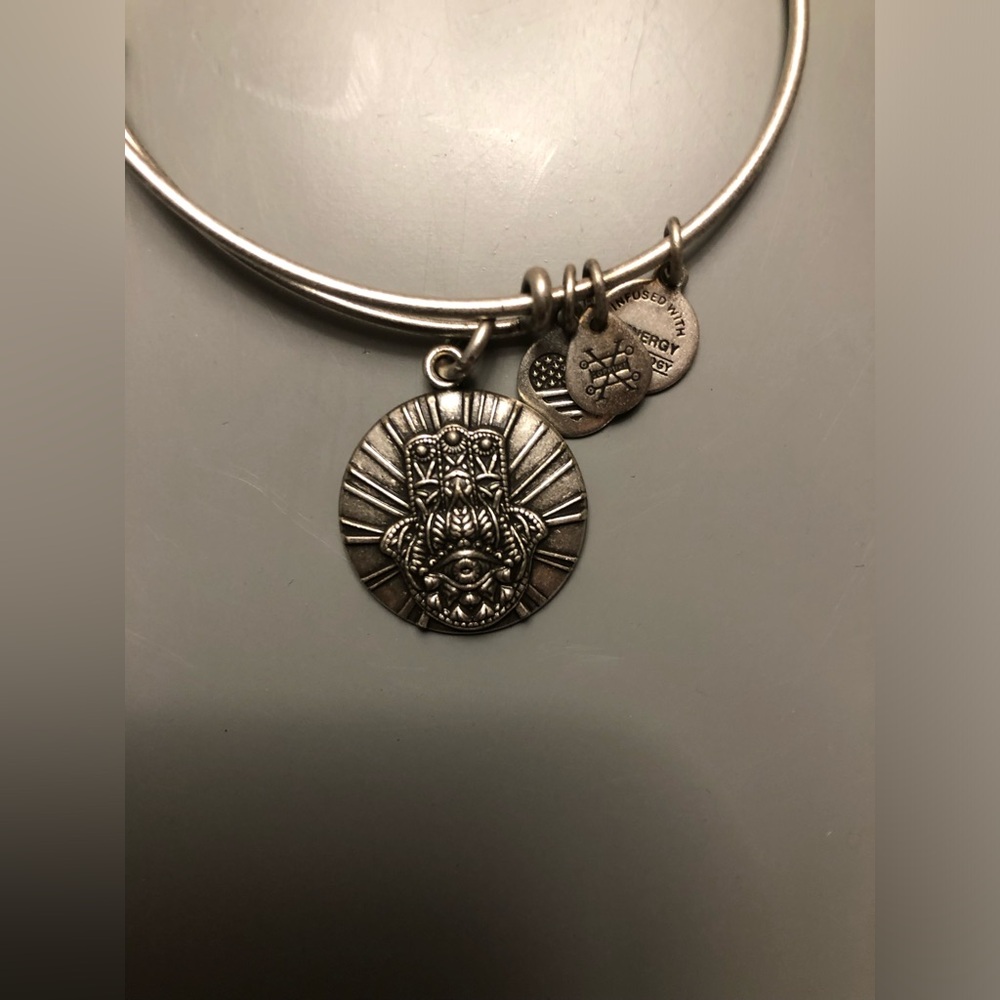 Alex and Ani silver Hamsa adjustable bangle. Looks great worn in a “stack”